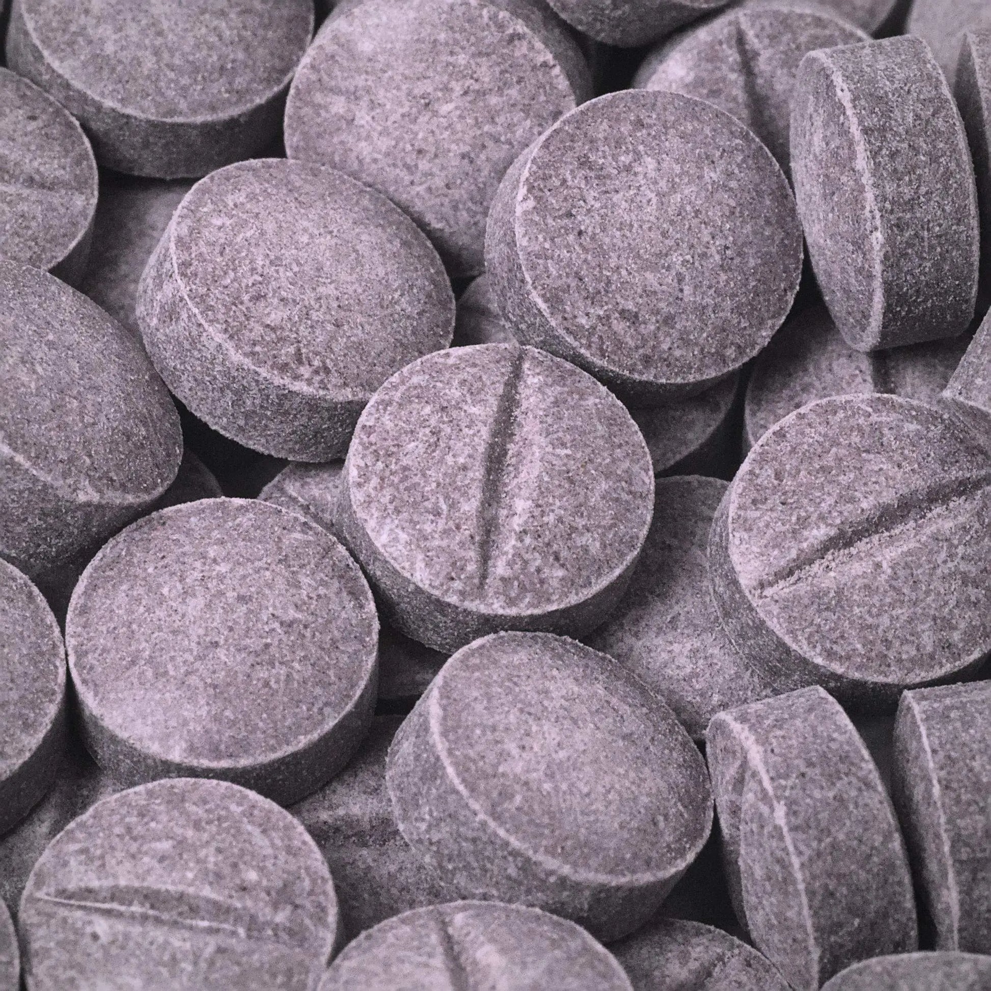Close-up of purple 7ohBLACK 7-oh tablets